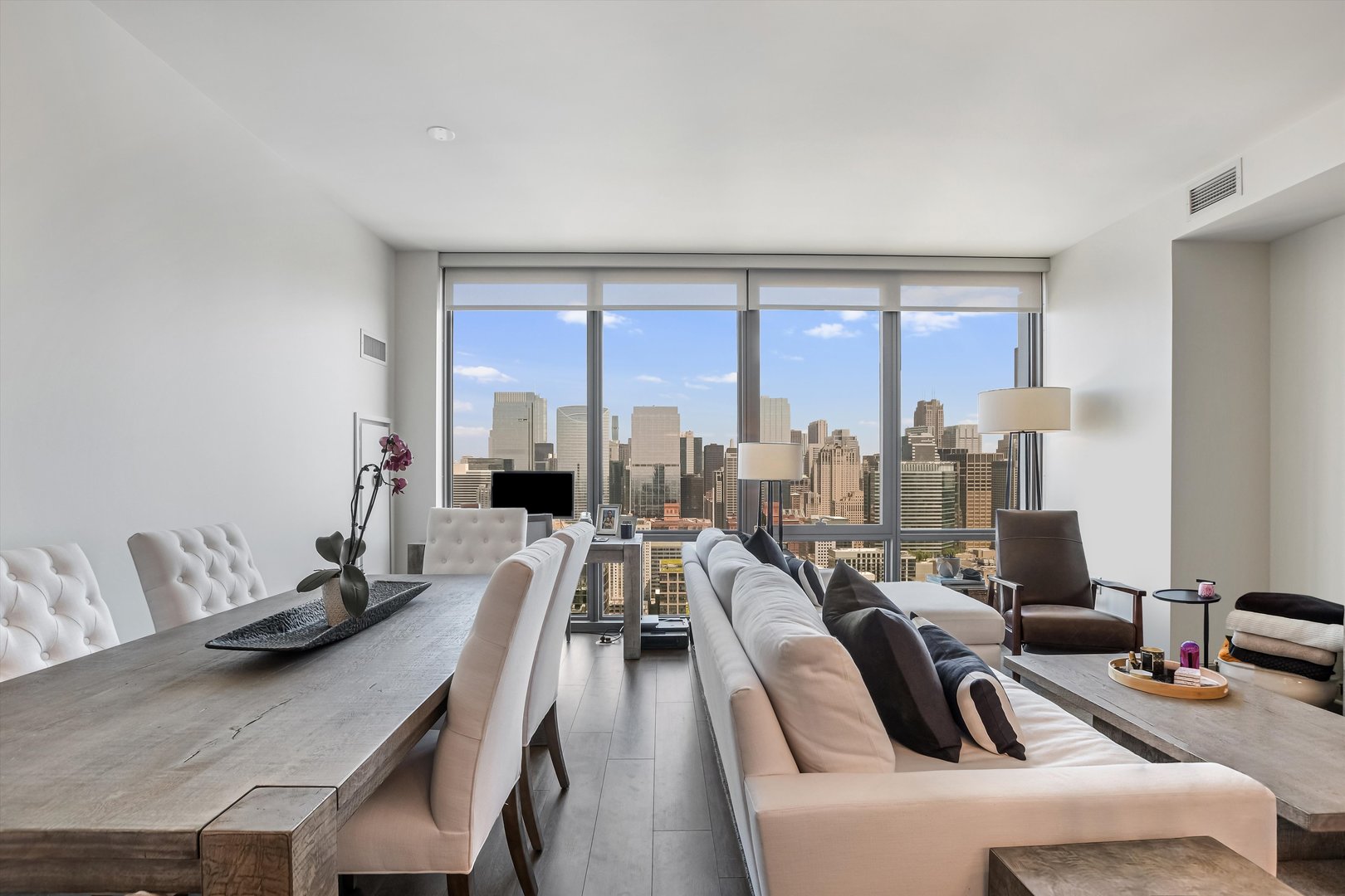 164 North Peoria Street, Unit 4004 Chicago, IL 60607 - Photo 3 of 32 a view of a dining room with furniture window and outside view