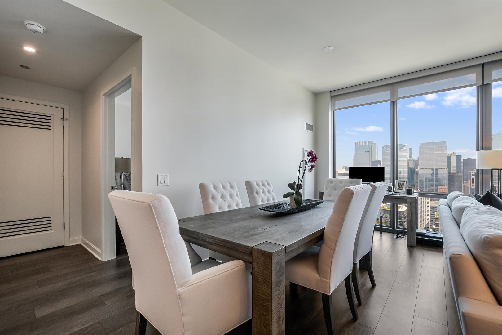 164 North Peoria Street, Unit 4004 Chicago, IL 60607 - Photo 6 of 32 a view of a dining room with furniture window and wooden floor