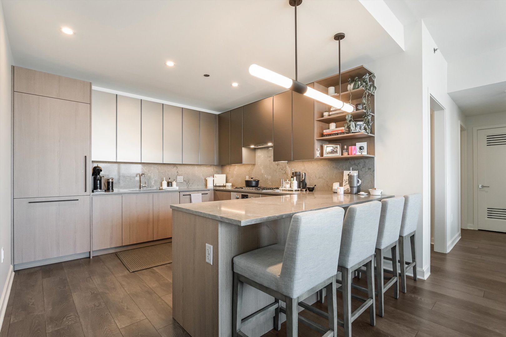 164 North Peoria Street, Unit 4004 Chicago, IL 60607 - Photo 9 of 32 a kitchen with sink cabinets and wooden floor