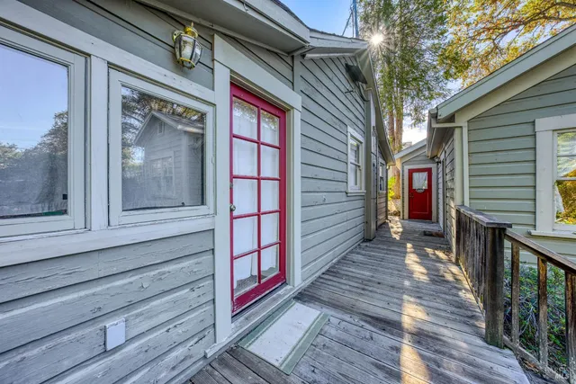 a view of a house with backyard and sitting area
