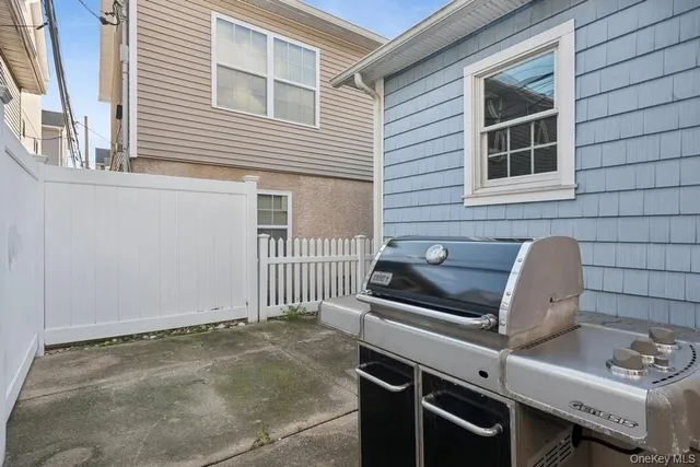 a view of a house with wooden deck