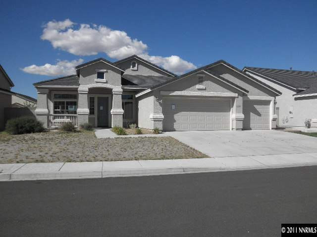 1625 Murrieta Court Reno, NV 89521 - Photo 1 of 10 a front view of a house with a yard and garage