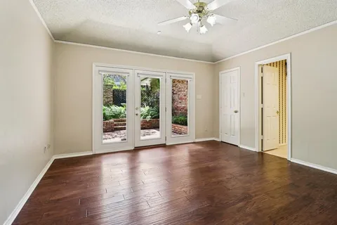 a view of house with backyard and outdoor seating