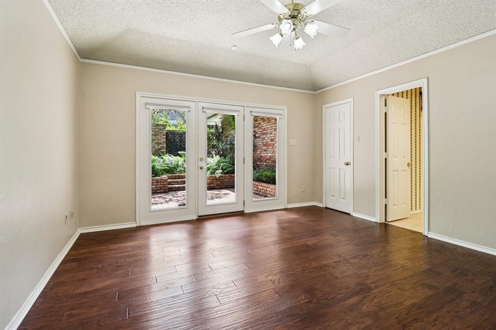 1015 Crowley Road Arlington, TX 76012 - Photo 28 of 36 a view of an empty room with wooden floor and a window