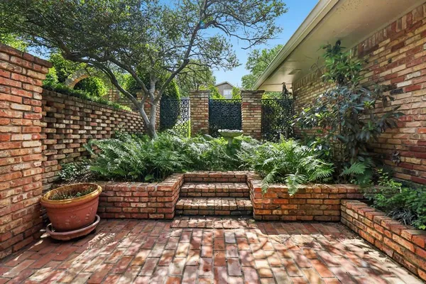 a view of swimming pool with a patio