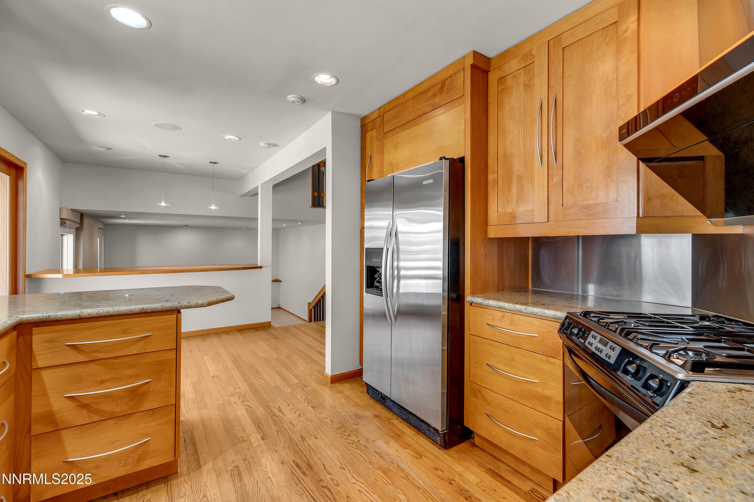 2593 Chaparral Court Reno, NV 89509 - Photo 11 of 37 a kitchen with stainless steel appliances granite countertop a refrigerator and a stove