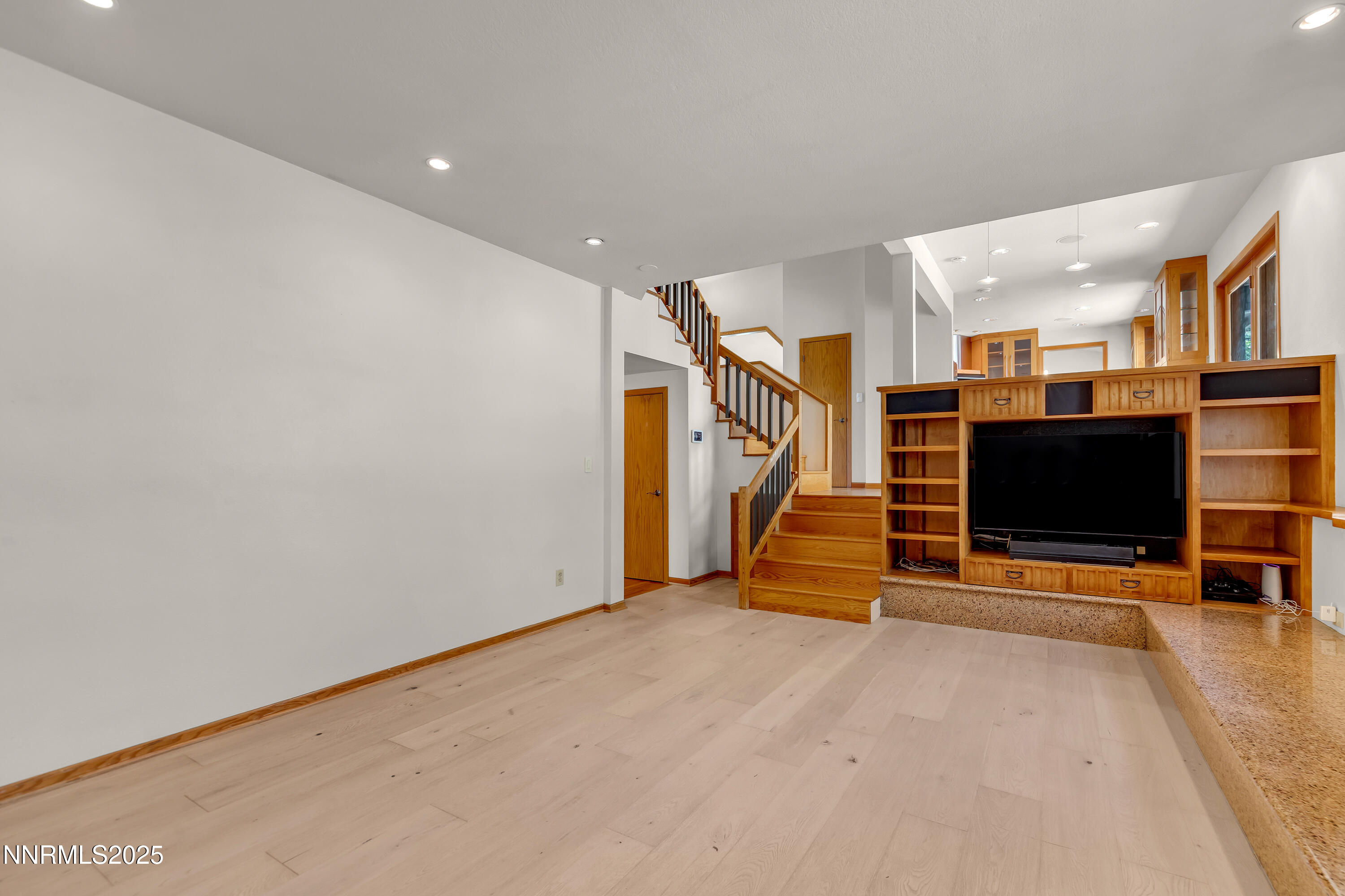 2593 Chaparral Court Reno, NV 89509 - Photo 16 of 37 a view of an empty room with wooden floor and furniture