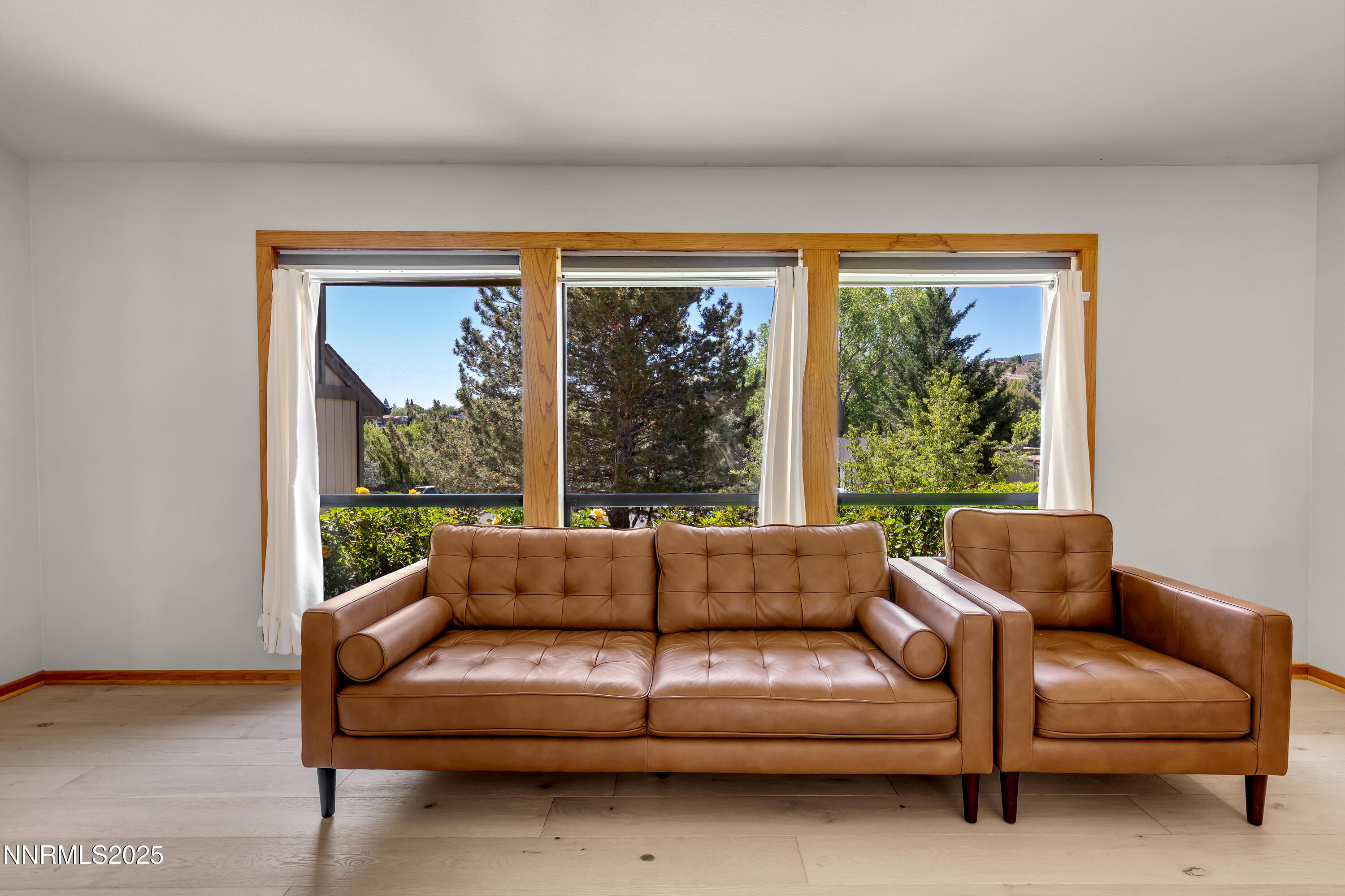2593 Chaparral Court Reno, NV 89509 - Photo 17 of 37 a living room with furniture and a large window
