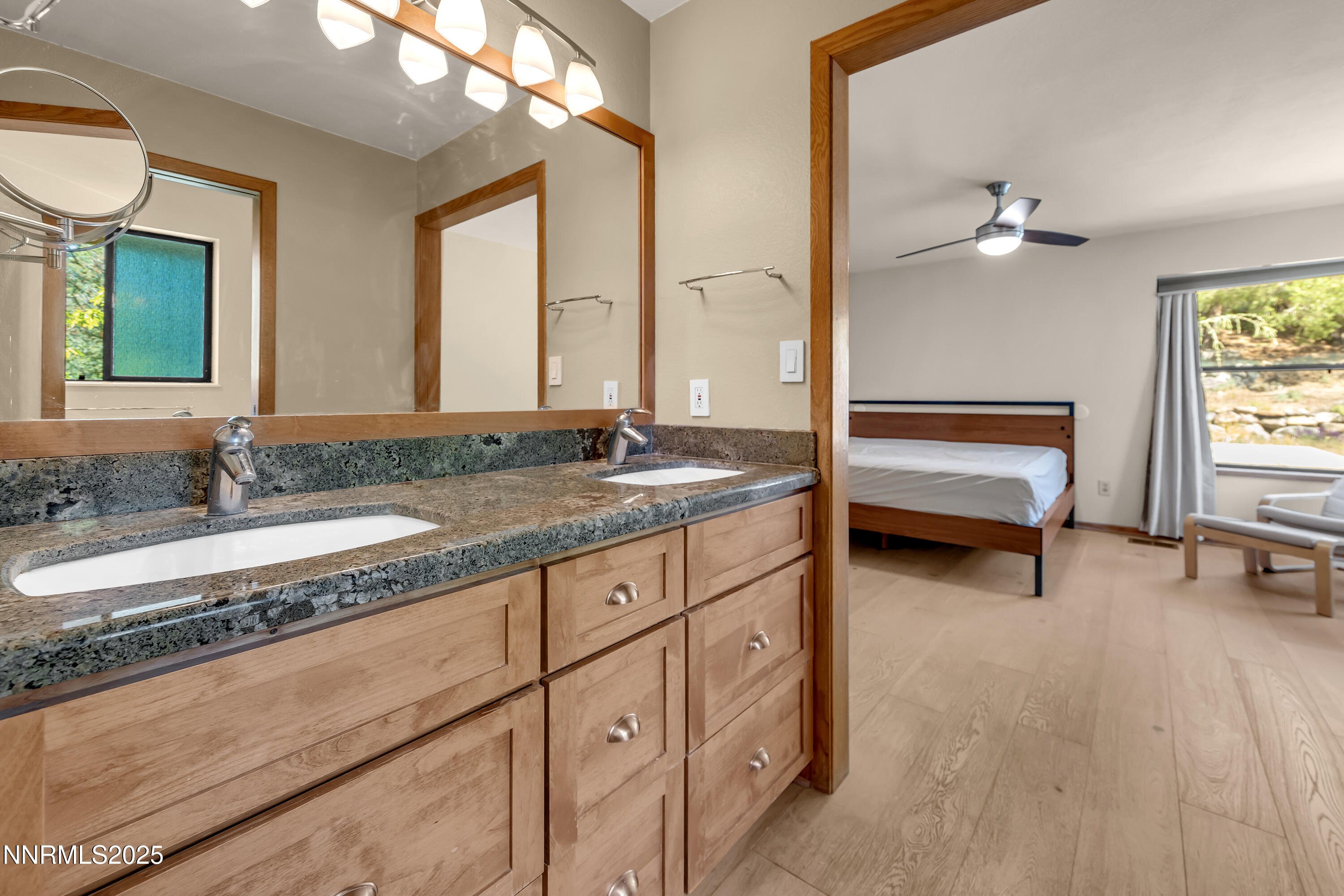 2593 Chaparral Court Reno, NV 89509 - Photo 20 of 37 a spacious bathroom with a granite countertop sink and a mirror