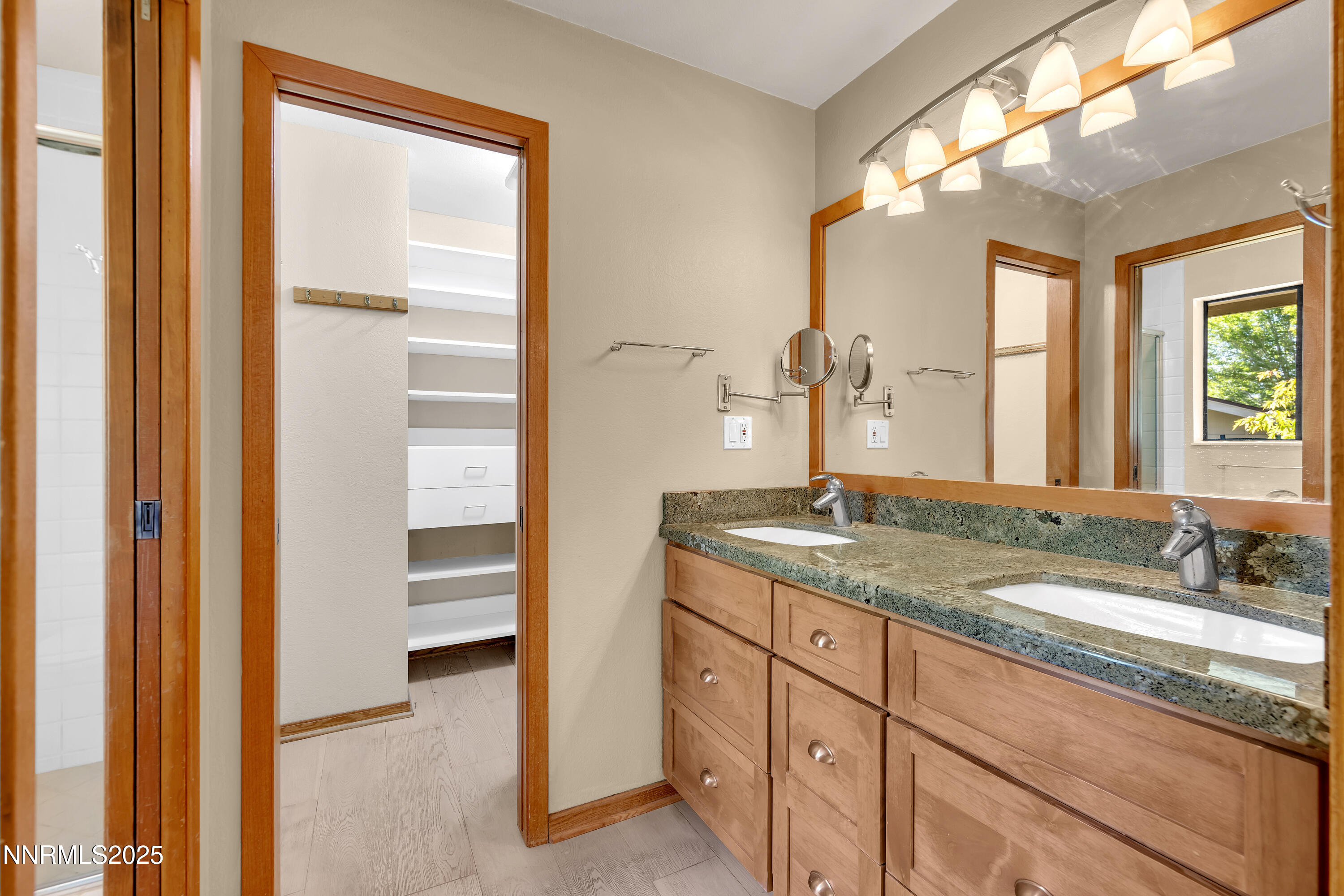 2593 Chaparral Court Reno, NV 89509 - Photo 21 of 37 a bathroom with a granite countertop sink and a mirror