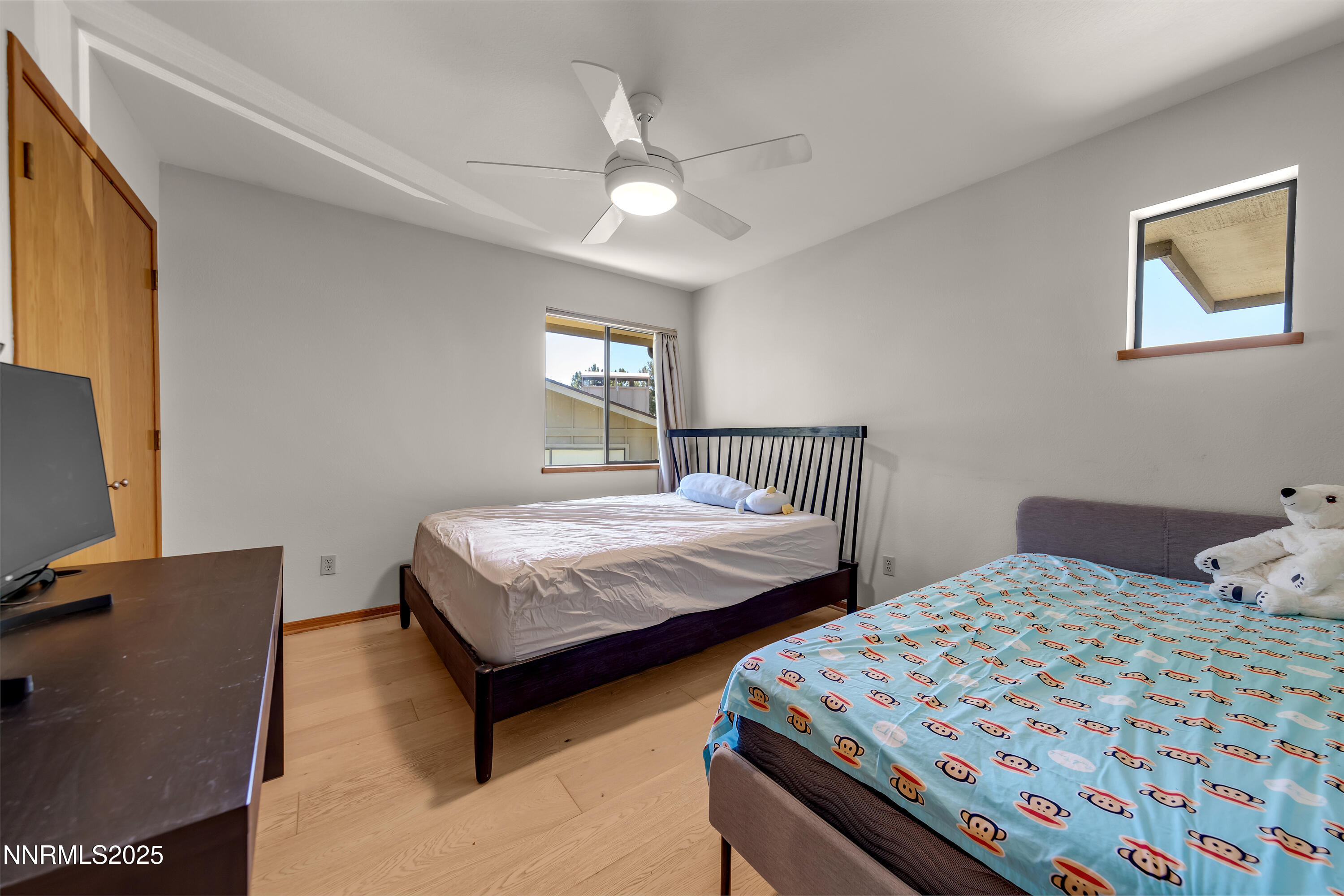 2593 Chaparral Court Reno, NV 89509 - Photo 24 of 37 a bedroom with two beds and a flat screen tv