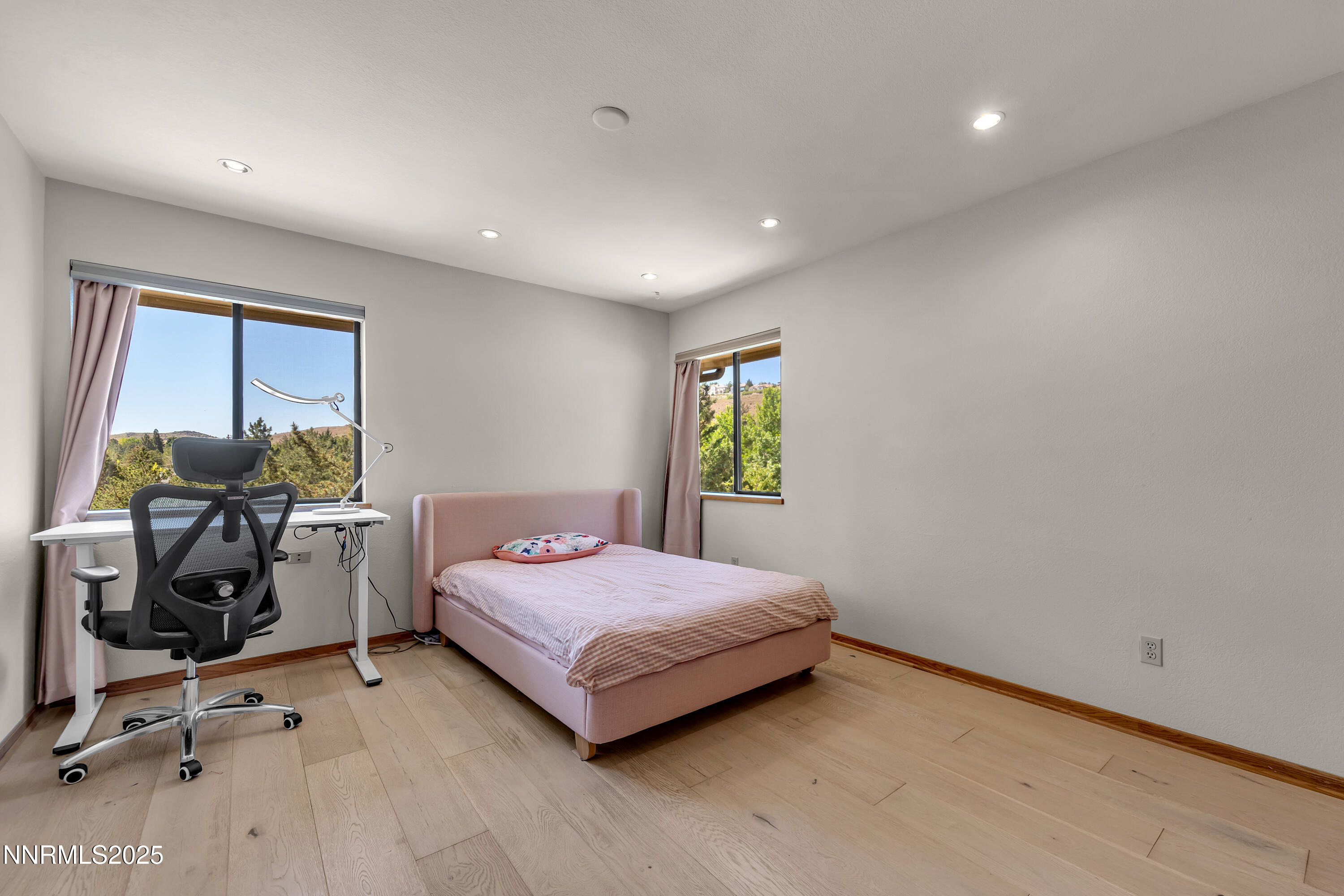 2593 Chaparral Court Reno, NV 89509 - Photo 26 of 37 a bedroom with a bed and a desk