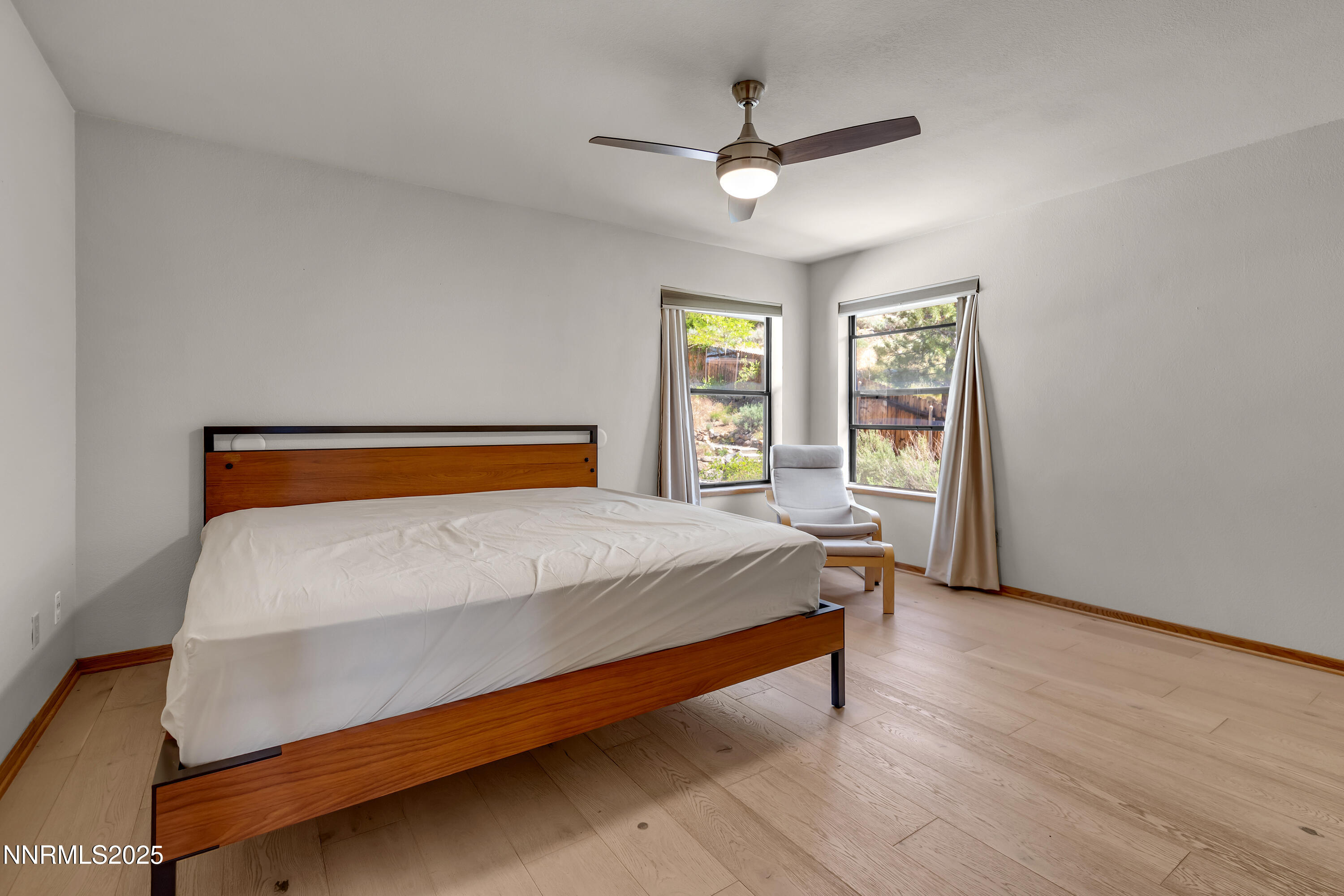 2593 Chaparral Court Reno, NV 89509 - Photo 28 of 37 a bedroom with a bed and window