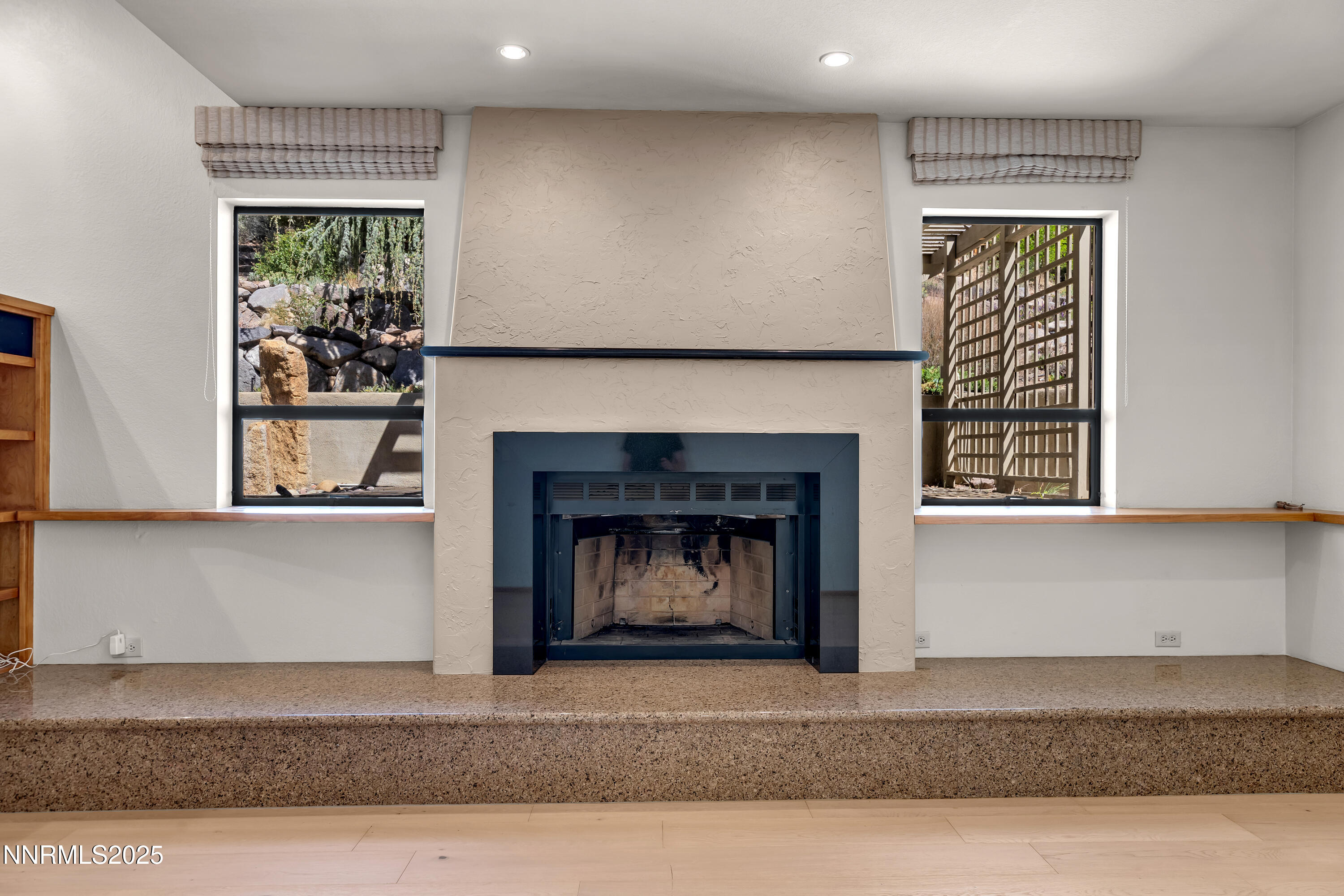2593 Chaparral Court Reno, NV 89509 - Photo 29 of 37 a living room with a fireplace and a window