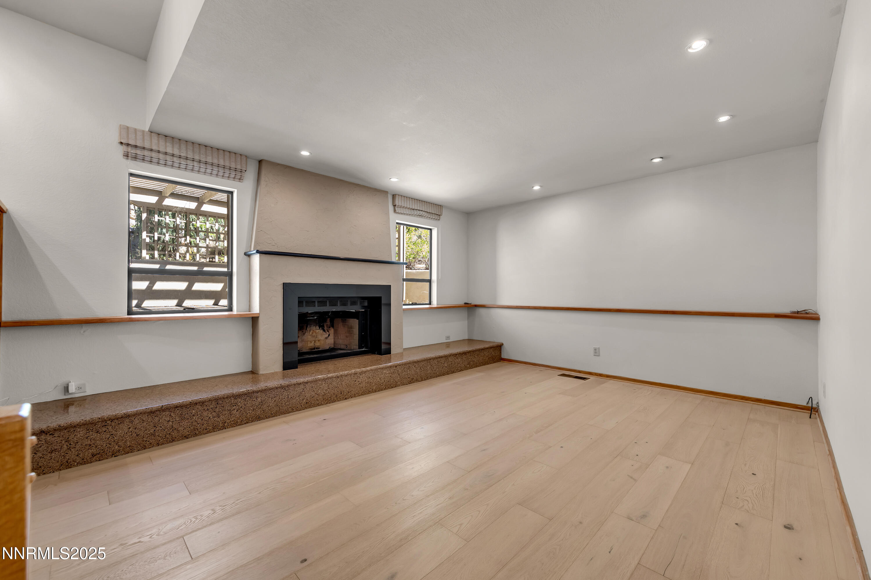 2593 Chaparral Court Reno, NV 89509 - Photo 30 of 37 a view of an empty room with a fireplace and a window