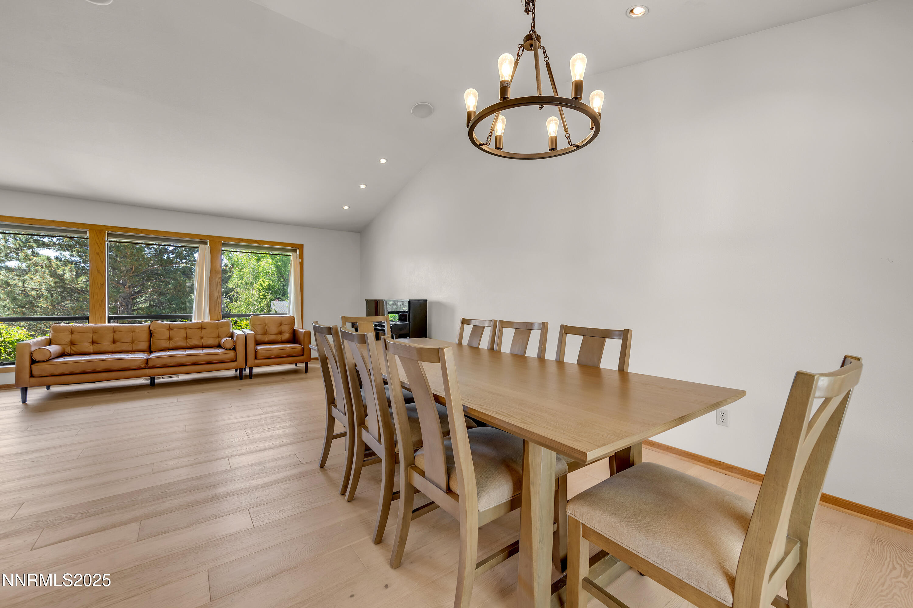 2593 Chaparral Court Reno, NV 89509 - Photo 34 of 37 a view of a dining room with furniture a chandelier and wooden floor
