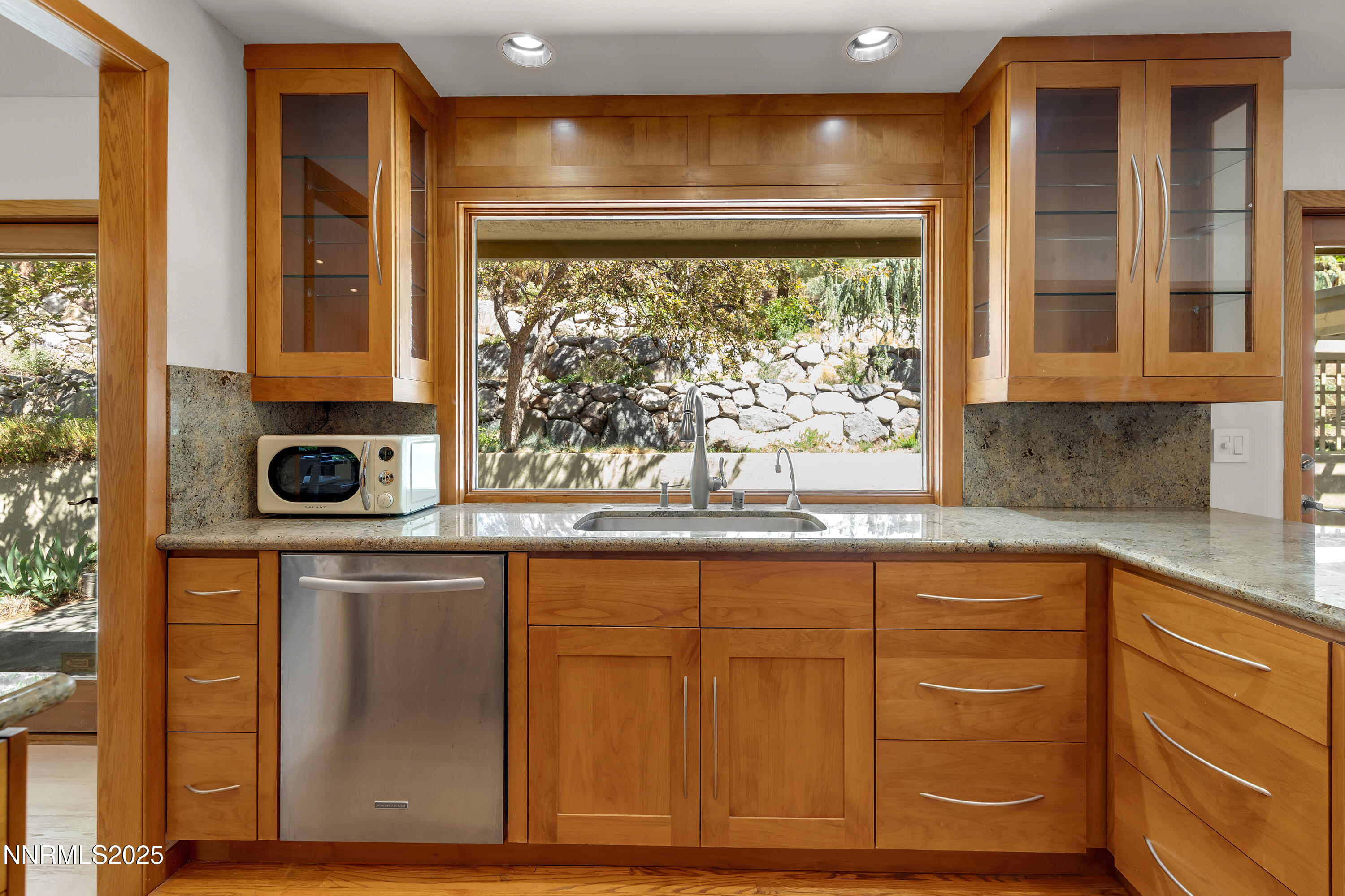 2593 Chaparral Court Reno, NV 89509 - Photo 7 of 37 a bathroom with a sink and a large mirror
