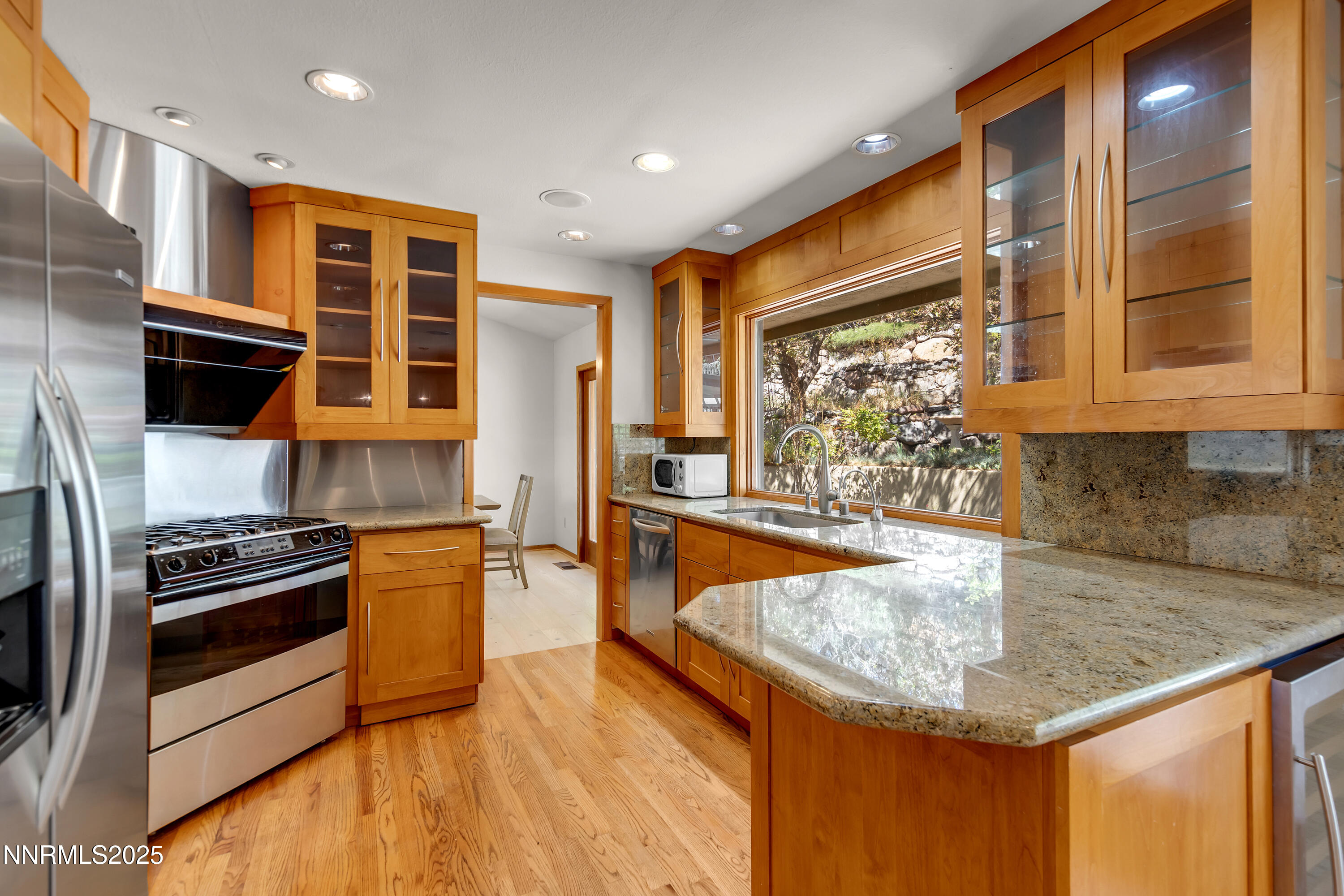 2593 Chaparral Court Reno, NV 89509 - Photo 8 of 37 a kitchen with stainless steel appliances granite countertop a sink and a stove