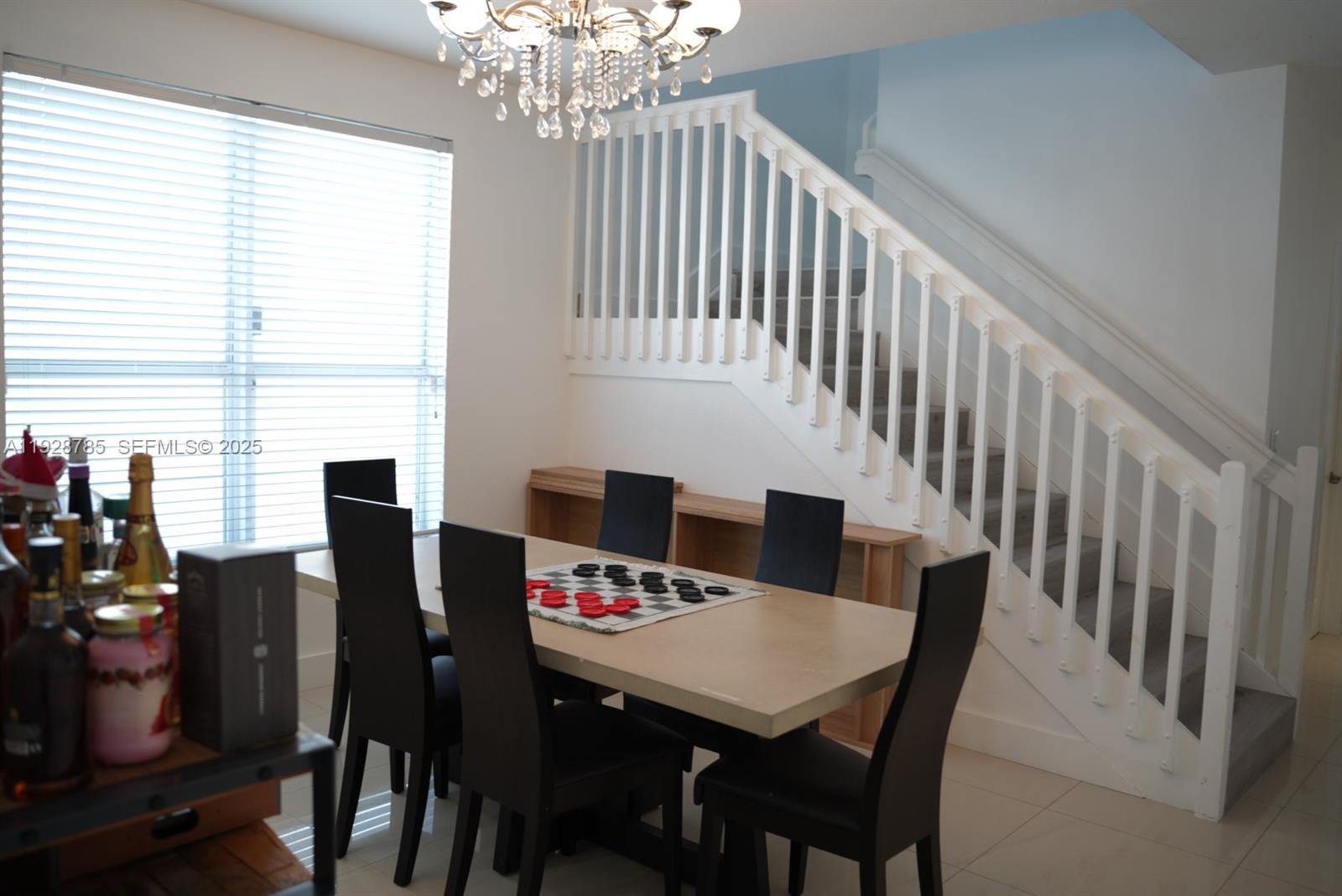 9443 Southwest 170th Path Miami, FL 33196 - Photo 11 of 22 a view of a dining room with furniture and window