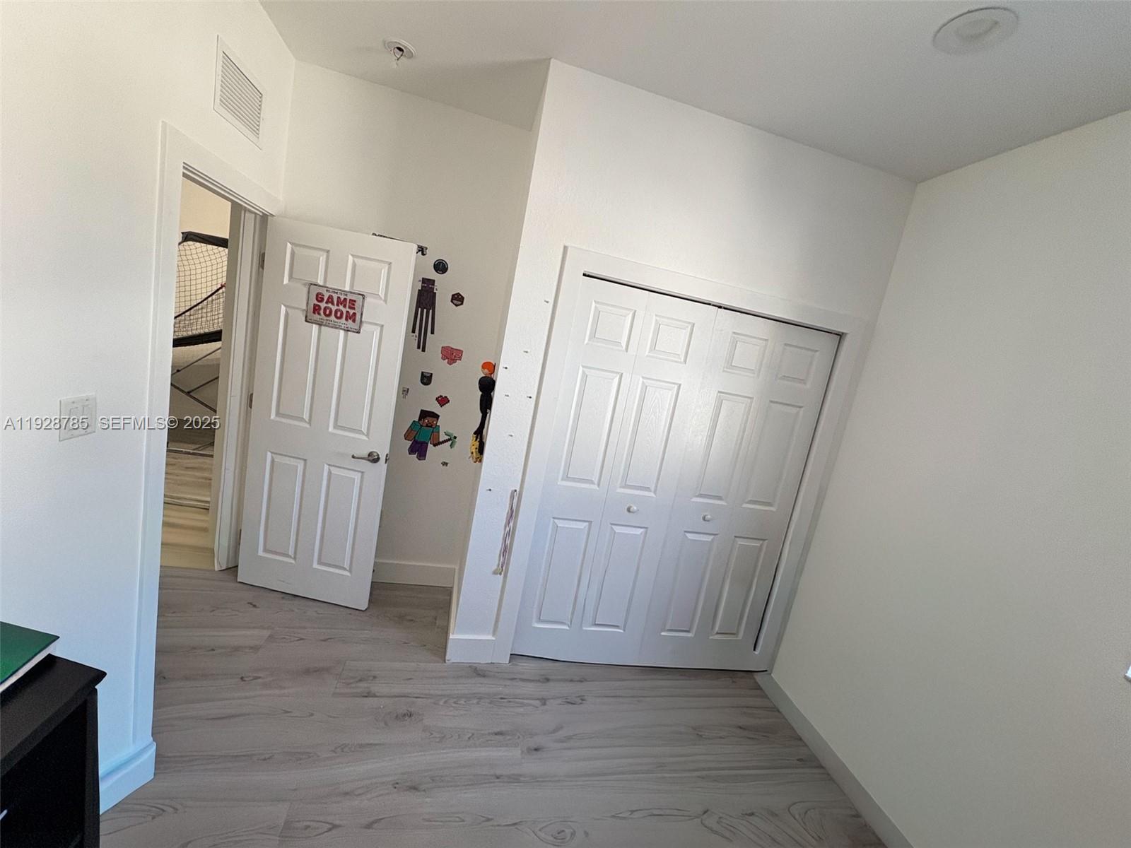 9443 Southwest 170th Path Miami, FL 33196 - Photo 20 of 22 a view of entryway with wooden floor