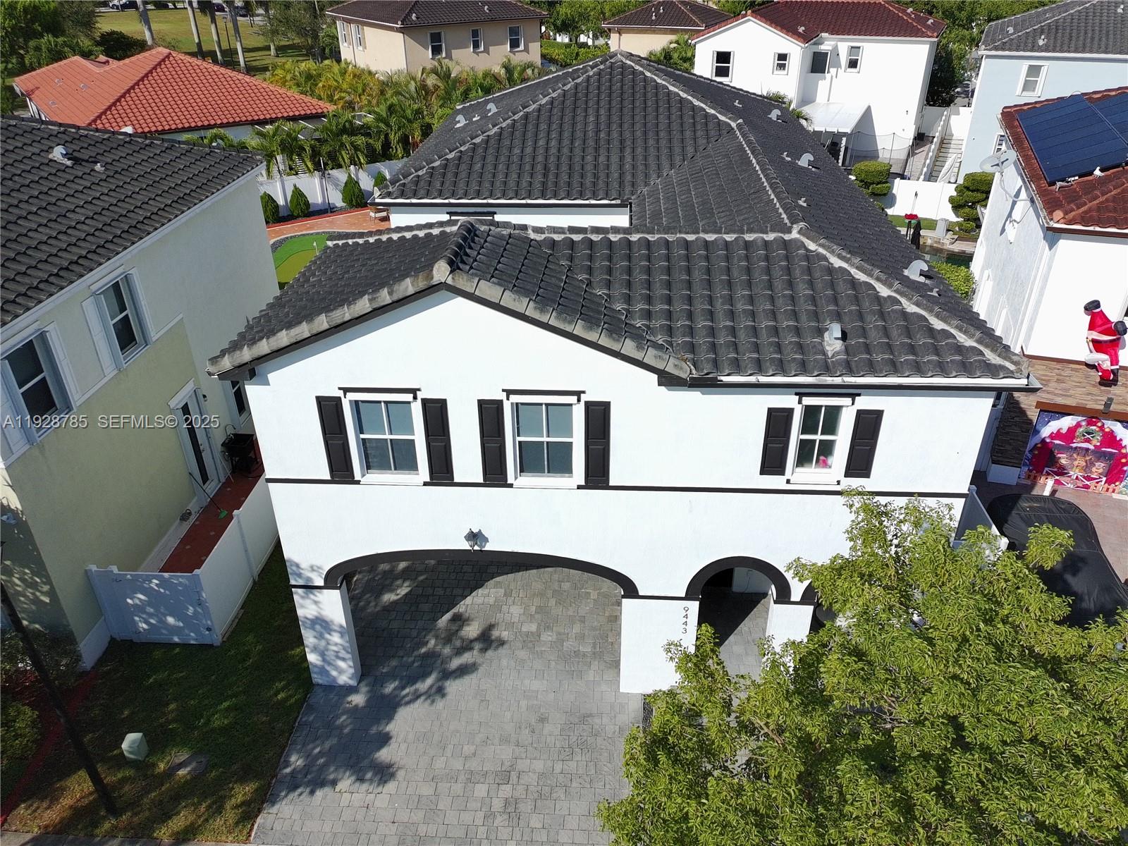 9443 Southwest 170th Path Miami, FL 33196 - Photo 2 of 22 an aerial view of a house