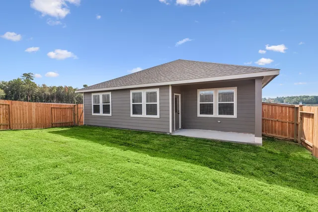 a backyard of a house with lots of green space