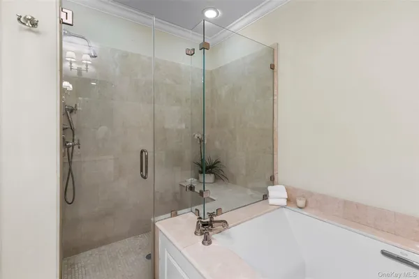 a bathroom with a sink a mirror and shower