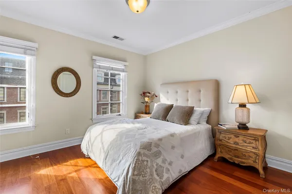 a bedroom with bed and a window
