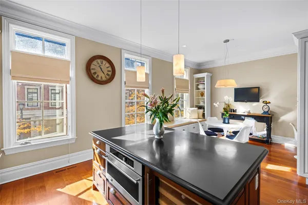 a view of a dining room with furniture and a window