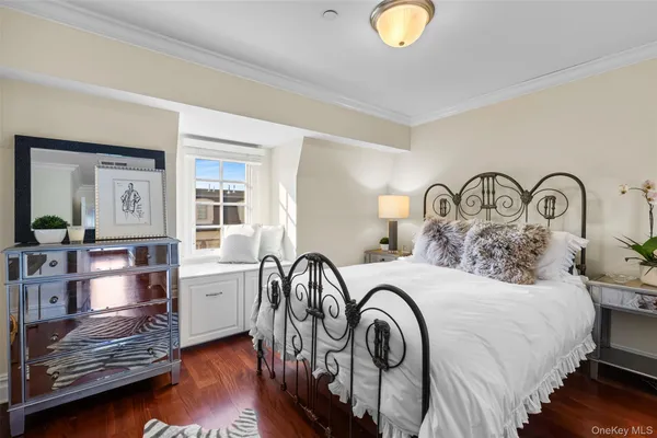a bedroom with bed and a window