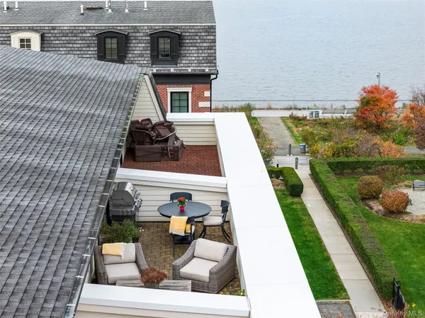 a view of house with backyard outdoor seating