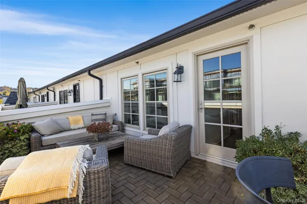 a outdoor living space with furniture and a potted plant