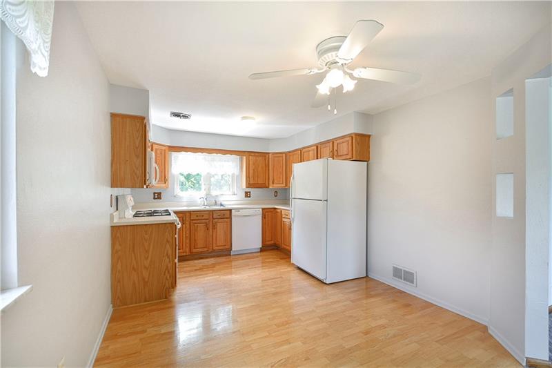 459 Marzolf Road Pittsburgh, PA 15209 - Photo 5 of 25 Light and bright eat-in kitchen with hardwood floors, oak cabinets and all appliances are included.