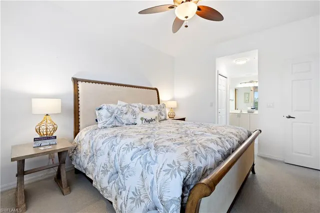 a bedroom with a bed and lamp