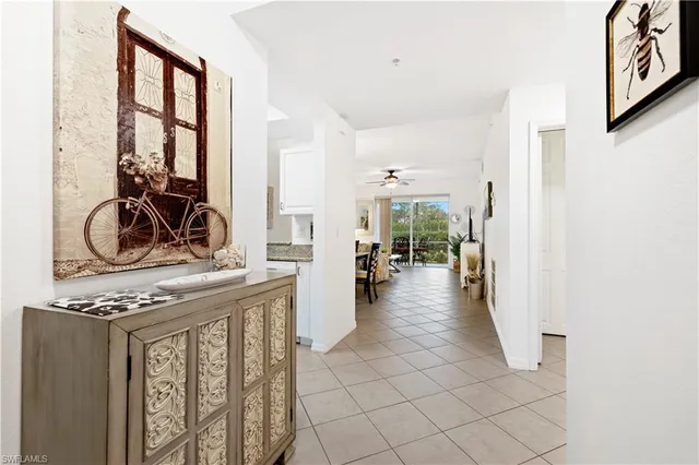 a view of a hallway with living room and furniture