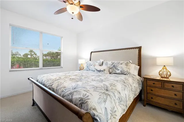 a bedroom with bed and window