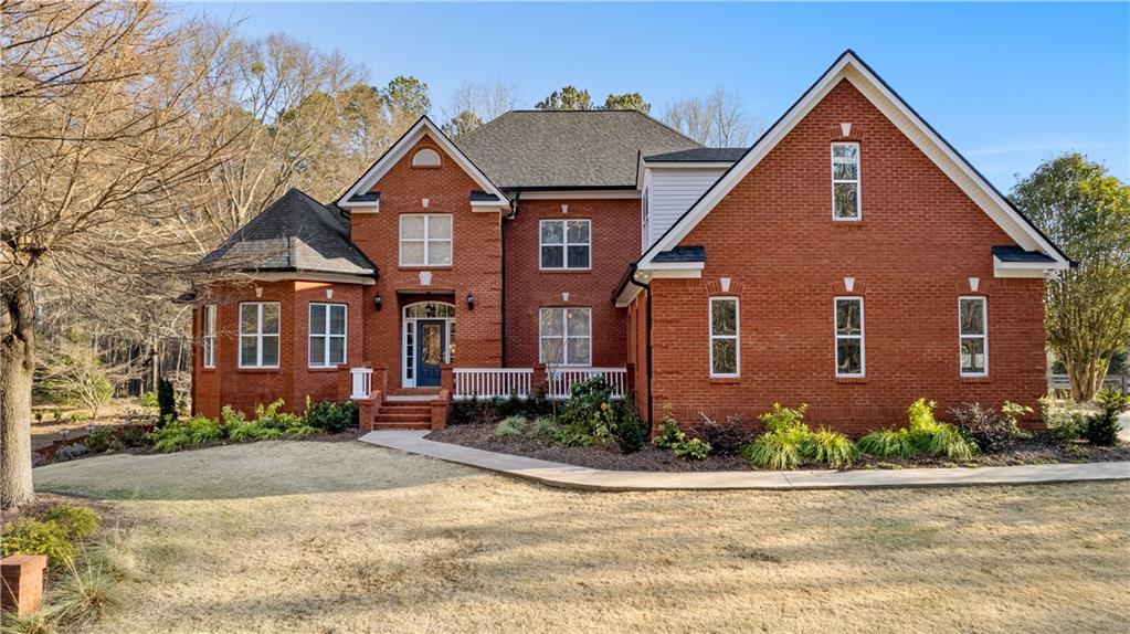 238 Chappell Road Fayetteville, GA 30215 - Photo 1 of 1 front view of a house next to a yard