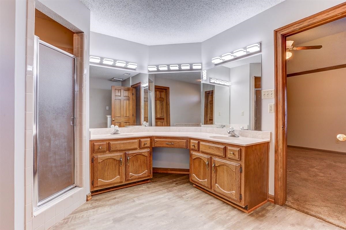 3915 Oak Road Bartlett, TN 38135 - Photo 11 of 28 a spacious bathroom with a granite countertop sink and a mirror