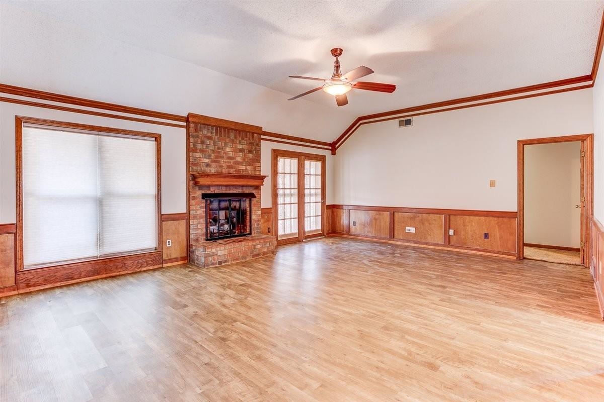 3915 Oak Road Bartlett, TN 38135 - Photo 17 of 28 a view of a livingroom with wooden floor and a fireplace