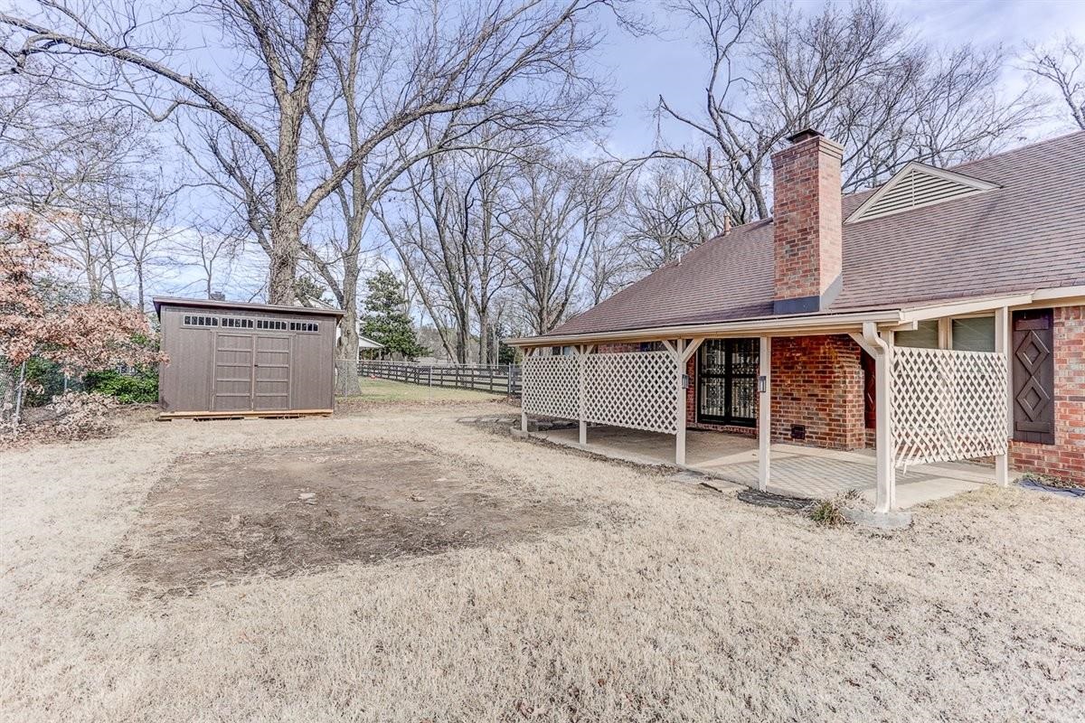 3915 Oak Road Bartlett, TN 38135 - Photo 20 of 28 a view of a house with a yard and garage