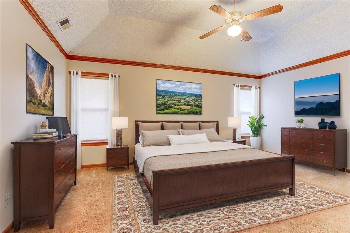 3915 Oak Road Bartlett, TN 38135 - Photo 2 of 28 a bedroom with a large bed and a chandelier