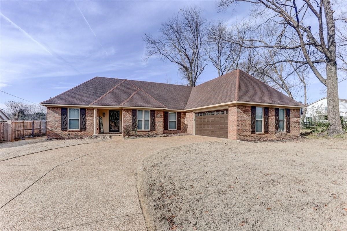3915 Oak Road Bartlett, TN 38135 - Photo 6 of 28 a front view of a house with yard and trees