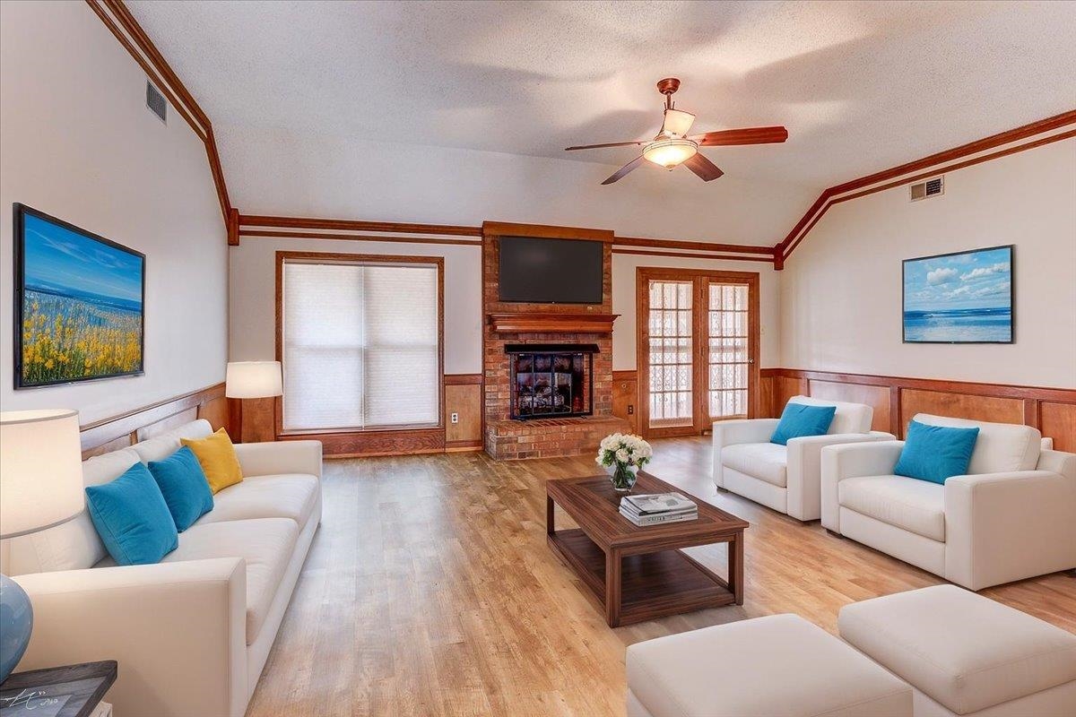 3915 Oak Road Bartlett, TN 38135 - Photo 7 of 28 a living room with furniture a flat screen tv and a fireplace