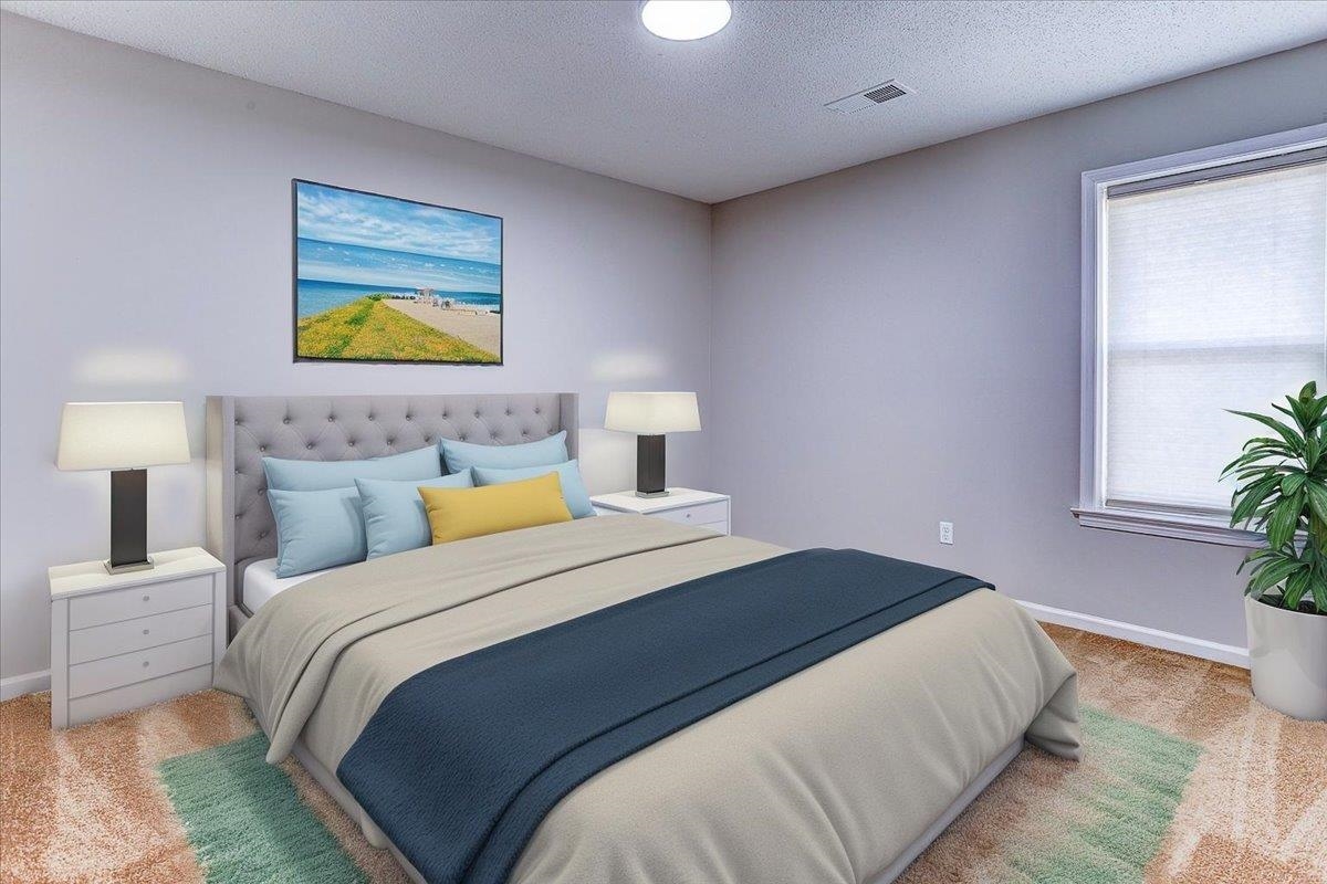 3915 Oak Road Bartlett, TN 38135 - Photo 9 of 28 a bedroom with a bed and potted plant