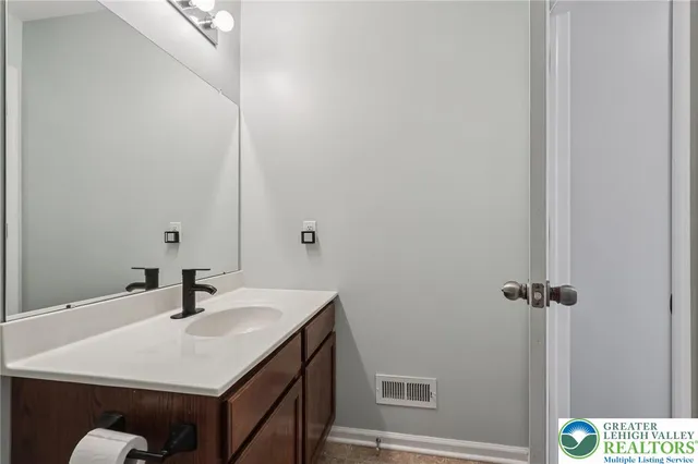 a bathroom with a shower a toilet and a shower