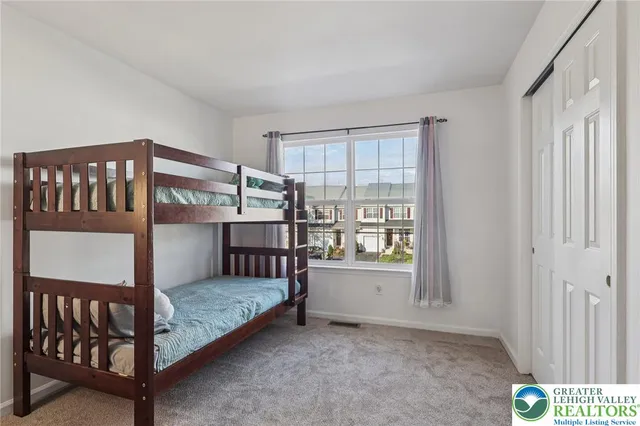 a view of living room with furniture and white cabinet