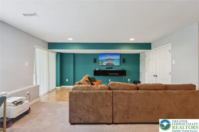 a front view of a house with a garden and yard