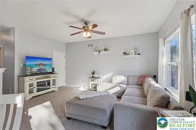 a view of a dining room with furniture wooden floor and a chandelier