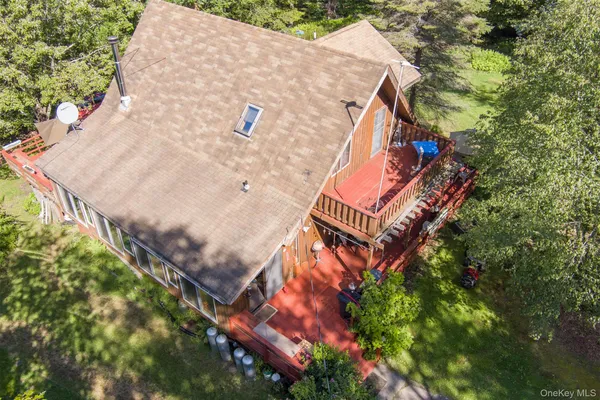 an aerial view of a house with a yard