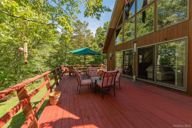 a view of a chairs and table in the balcony